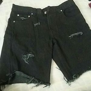 Distressed cut off black jean shorts